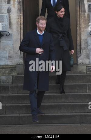 Cardiff, Wales, UK. 18th Jan, 2018. Harry and Meghan leave Cardiff Castle. She is sporting a long black coat by Stella McCartney, black jeans by Welsh brand Hiut Denim, Tabitha Simmons black velvet kiki ankle boots and a green DeMellier London bag.Picture Credit: IAN HOMER/Alamy Live News Stock Photo