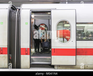 Berlin, Germany. 18th Jan, 2018. A passenger stands in a coach of an Intercity-Express train at the Berlin Central Train Station in Berlin, capital of Germany, on Jan. 18, 2018. All long-distance trains in Germany have been cancelled and at least three people were killed as a result of the storm 'Friederike', the German Press Agency (DPA) updated. Credit: Shan Yuqi/Xinhua/Alamy Live News Stock Photo