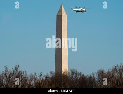 Arlington, United States Of America. 18th Jan, 2018. Marine One helicopter carrying U.S. President Donald Trump passes the Washington Monument on departure from the Pentagon January 18, 2018 in Arlington, Virginia. Credit: Planetpix/Alamy Live News Stock Photo