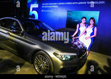 KUALA LUMPUR, MALAYSIA - JANUARY 18: A Model poses with BMW 530e Sport car inside the show room during introducing of the first BMW 5 Series Hybrid with Edrive in Kuala Lumpur on January 18, 2018. Credit: Samsul Said/AFLO/Alamy Live News Stock Photo