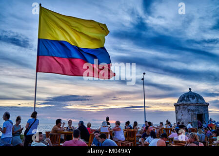 waving Colombian flag again sunset sky at Cafe del Mar, Cartagena de Indias Stock Photo