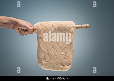 Old man holding a dough. Stock Photo