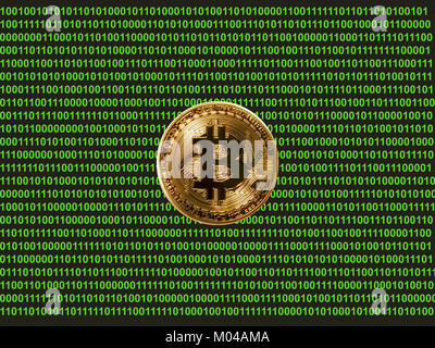 bitcoin on screen with binary numbers Stock Photo