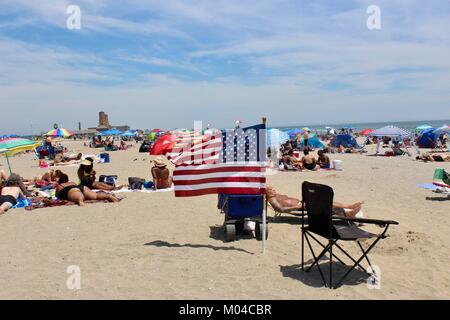 stars and stripes flag planted on jakob riis beach queens new york for presidents day public holiday Stock Photo