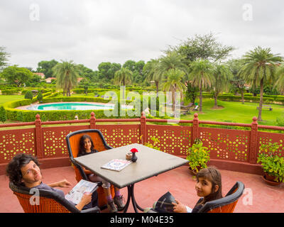 travelers  - mother and her two daughters sitting having fun and relax at the resort Stock Photo