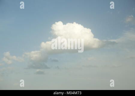 White cloud in the soft blue sky. Dramatic sky background. Stock Photo