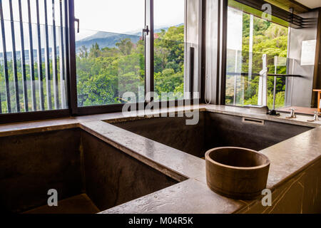 The private hot and cold spring tub with a wooden bucket and a scenic view in the Grand View Resort Beitou, Taipei, Taiwan. Taken in September 2014. Stock Photo