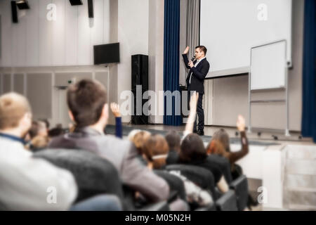 speaker speaks at a business conference in front of entrepreneurs and journalists Stock Photo