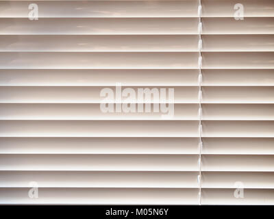 Closed window blinds background in sunny day Stock Photo