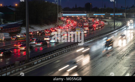 Night view of traffic on M8 Motorway during bad weather in central Glasgow, Scotland, United Kingdom. Stock Photo