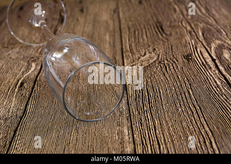 Empty wine glass lay on wooden background Stock Photo