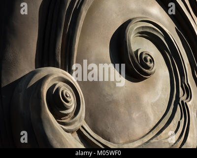 Abstract spirals at the back of a bronze monument, Austria Stock Photo