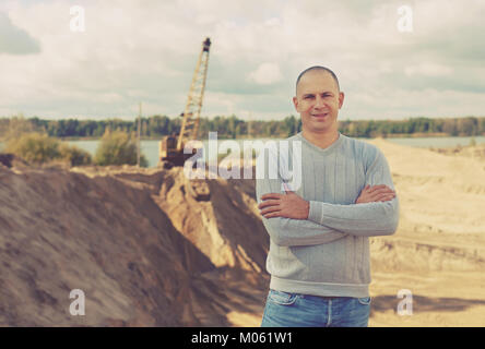 Portrait of worker  at sand pit Stock Photo