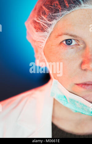 Female allergist immunologist half face portrait, healthcare professional wearing protective mask Stock Photo