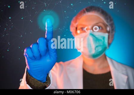 Healthcare worker using modern innovative technology in medicine, female doctor working on virtual screen Stock Photo