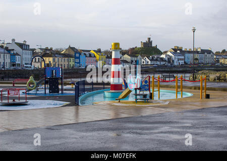 The colourful children's playground on the seafront in Donaghadee county Down in Northern Ireland in a freezing winter afternoon Stock Photo
