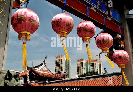 Beautiful pink Chinese lanterns hanging from a classical archway celebrating Chinese Lunar New Year at Siong Lim Buddhist Monastery in Singapore Stock Photo