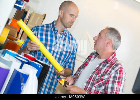 concentrated engineers thinking about best way to end project Stock Photo