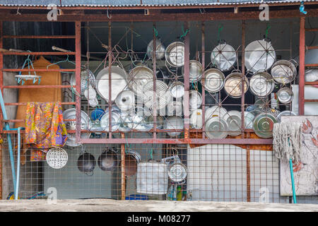 Pots and pans hung up in a Thai kitchen Stock Photo
