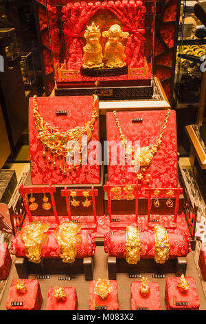 China, Hong Kong, Kowloon, Jewellery Shop Window Display of Gold Jewellery and Ornaments Stock Photo