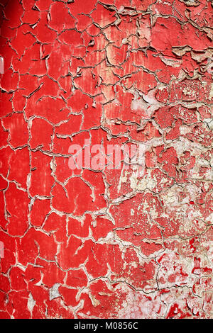 Cracking and peeling paint on a wall, background or texture, selective focus. Stock Photo