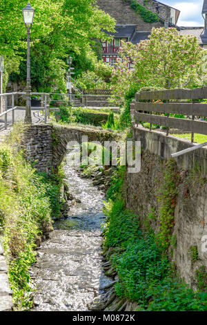 Medieval stone bridges lead across a brook in Bacharach to the Rhine river in Germany Stock Photo