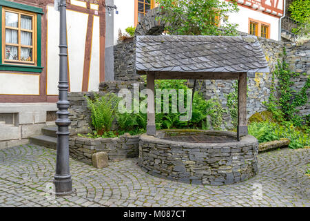 Medieval fountain in the town center of Bacharach, Germany Stock Photo