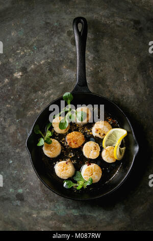 Fried scallops with butter sauce Stock Photo