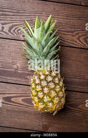 Fresh pineapple on wooden background Stock Photo