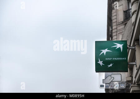 PARIS, FRANCE - DECEMBER 20, 2017: BNP Paribas logo on their bnk branch on Rue de Rivoli avenue. BNP Paribas is a French bank, one of the biggest in F Stock Photo