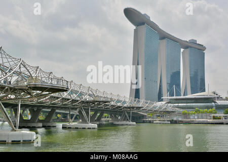 Singapore, Singapore - December 11, 2017. View of Marina Bay Sands building and Helix pedestrian bridge in Singapore. Stock Photo