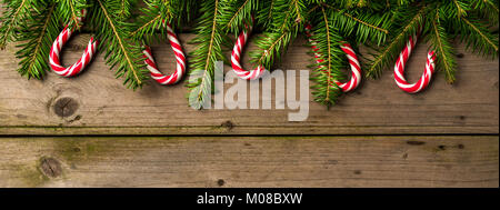 Christmas background with tree and candy canes. Stock Photo