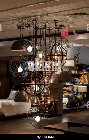 Elegant light fixture on display in furniture store with edison type light bulbs. Stock Photo