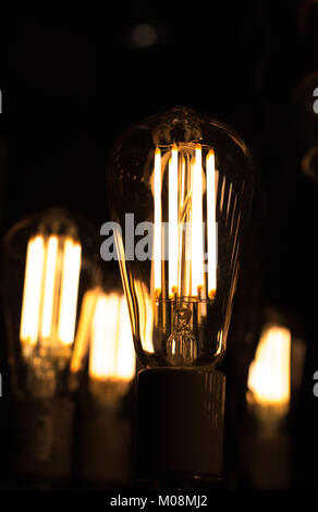 Decorative antique edison style light bulbs are in fact contamplorary LED light bulds made to look like old school. Creating old style look and saving Stock Photo