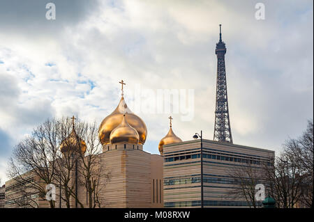 Holy Trinity cathedral and Eiffel tower in Paris Stock Photo