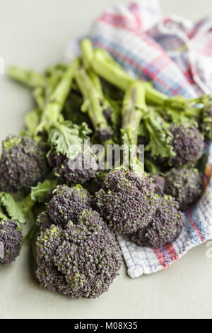 fresh broccoli rabe on dish towel Stock Photo