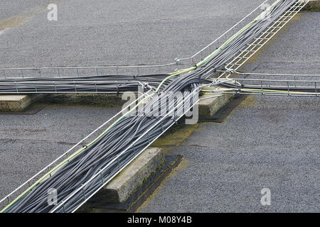 Electric cable on the top roof of a building Stock Photo