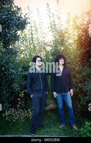 The two Grammy award-winning American musicians, singers and music producers Omar Ródriguez-López (L) and Cedric Bixler-Zavala (R) are the founders of the progressive rock back Antemasque and are here pictured during a live tour in Europe. Germany, 04/10 2014. Stock Photo