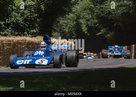 Sir Jakie Stewart and his sons driving at Goodwood Festival Of Speed Stock Photo