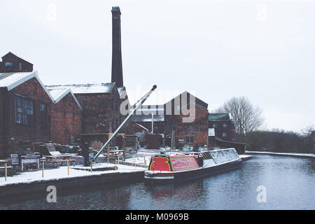 Narrowboat moored near poteries on Trent and Mersey Canal in winter scenery,Stoke on Trent,Staffordshire,United Kingdom,10th December,2017. Stock Photo