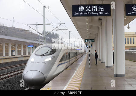 Guiyang, China's Guizhou Province. 18th Jan, 2018. A bullet train for test operation stops at Zunyinan Railway Station in Zunyi City, southwest China's Guizhou Province, Jan. 18, 2018. A railway connecting Chongqing and Guiyang, two major cities in southwest China, will open Jan. 25. With a total length of 347 kilometers, the railway will have 12 stops. Designed for passenger trains running at a speed of 200 km per hour, the railway will improve traffic between China's southwest and the rest of the country. Credit: Wu Jibin/Xinhua/Alamy Live News Stock Photo