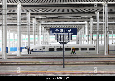 Guiyang, China's Guizhou Province. 18th Jan, 2018. Workers check a bullet train at Guiyangbei Railway Station in Guiyang, capital of southwest China's Guizhou Province, Jan. 18, 2018. A railway connecting Chongqing and Guiyang, two major cities in southwest China, will open Jan. 25. With a total length of 347 kilometers, the railway will have 12 stops. Designed for passenger trains running at a speed of 200 km per hour, the railway will improve traffic between China's southwest and the rest of the country. Credit: Wu Jibin/Xinhua/Alamy Live News Stock Photo