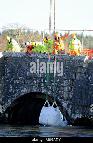 Repair work begins on historic Wool Bridge, Dorset, UK, Work begins on protecting the bridge from further damage. Wool Bridge, a 16th century, Grade II listed structure, crosses the River Frome in Wool, Purbeck and features in Tess of the D'Urbervilles by Thomas Hardy Credit: Finnbarr Webster/Alamy Live News Stock Photo