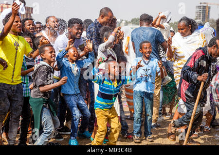 Addis Ababa, Ethiopia. 19th January 2018. Ethiopian Christians celebrate the festival of Timkat (Epiphany) by being sprayed with water at the Jan Meda sports ground in Addis Ababa, Ethiopia. Credit: Grant Rooney/Alamy Live News Stock Photo