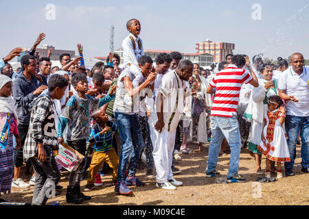 Addis Ababa, Ethiopia. 19th January 2018. Ethiopian Christians celebrate the festival of Timkat (Epiphany) by being sprayed with water at the Jan Meda sports ground in Addis Ababa, Ethiopia. Credit: Grant Rooney/Alamy Live News Stock Photo