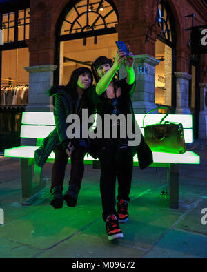 London, UK. 19th Jan, 2018. Two visitors take selfies on Bernd Spiecker's Lightbench installation. Lumiere London is a lights festival that presents an array of public art work and light installations across the capital. Credit: Imageplotter News and Sports/17�Թ����� Live News Stock Photo