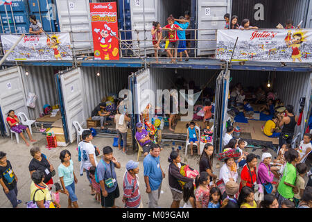 Ceby City, Philippines. 20th Jan, 2018. Numbering in the hundreds of thousands Filipino Catholics descend upon Cebu City for the annual Sinulog Festival, one of the largest religious festivals in the Philippines.To cater for the mass influx the Cebu City Government makes temporary accommodation available in the form of shipping containers. Approximately 88 containers will house up to 1200 religious devotees with 20 people to a container. Credit: imagegallery2/Alamy Live News Stock Photo