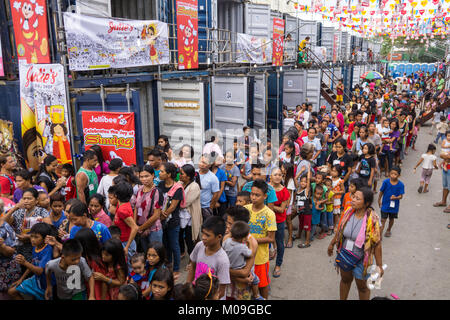 Ceby City, Philippines. 20th Jan, 2018. Numbering in the hundreds of thousands Filipino Catholics descend upon Cebu City for the annual Sinulog Festival, one of the largest religious festivals in the Philippines.To cater for the mass influx the Cebu City Government makes temporary accommodation available in the form of shipping containers. Approximately 88 containers will house up to 1200 religious devotees with 20 people to a container. Credit: imagegallery2/Alamy Live News Stock Photo