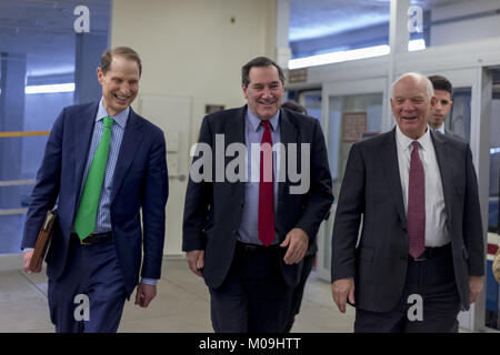 Washington, District of Columbia, USA. 19th Jan, 2018. United States Senator Ron Wyden (Democrat of Oregon) left, US Senator Joe Donnelly (Democrat of Indiana), center, and US Senator Ben Cardin (Democrat of Maryland), walk through the Senate Subway on their way to a Democratic Caucus meeting on a night when Congress tries to pass a spending bill to avoid a government shutdown in Washington, DC on January 19th, 2018. Credit: Alex Edelman/CNP Credit: Alex Edelman/CNP/ZUMA Wire/Alamy Live News Stock Photo