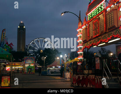 Fort Worth, USA. 19th Jan, 2018. Carnival and midway welcomes visitors to the Fort Worth Stock Show and Rodeo with the Pioneer Tower rising up to mark the way to the first indoor rodeo that is celebrating it's 100th anniversary in 2018 Credit: J. G. Domke/Alamy Live News Stock Photo